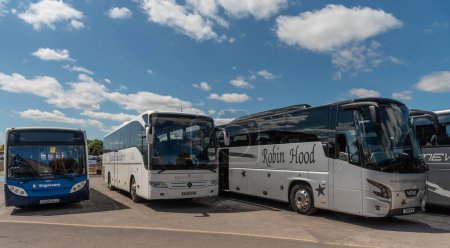 Photo for Salisbury, Wiltshire, England, UK. 6 August 2023. Commercial coaches parked in the city centre, leaving the tourists to tour the city centre. - Royalty Free Image