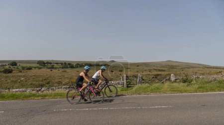 Photo for Dartmoor, Devon, England, UK. 4 September 2023. Women cyclists  on a cycle tour on Dartmoor national park, Devon, England, UK. - Royalty Free Image