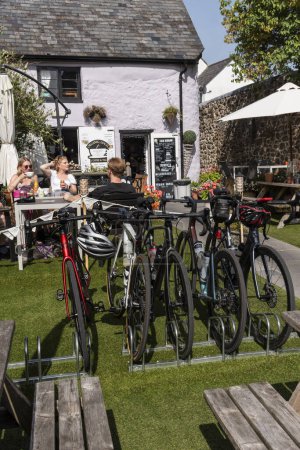 Photo for Moretonhampstead, Devon, England, UK. 05.09.2023. Cycle rack for customer use in the garden of a cafe in Moretonhampstead, north Devon, England, United Kingdom. - Royalty Free Image