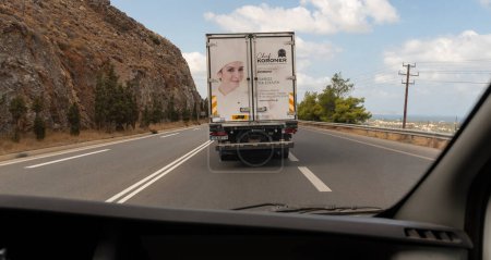 Photo for Heraklion, Crete, Greece, Europe. 02.10.2023.  Rear view of a catering industry truck on the national road approaching Heraklion Crete. - Royalty Free Image