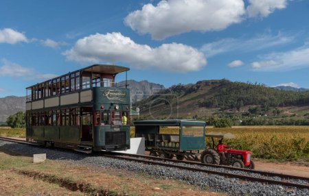 Photo for Franschhoek  Western Cape South Africa. 05/03/2024. Tourist tram at Rickety Bridge station on a wwine tour  in the western cape. - Royalty Free Image
