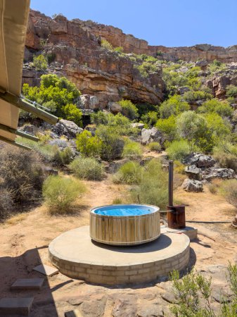 Photo for Vleiplaas Clanwilliam Cederberg South Africa. 14/02/2024. A wood fired hot tub on a campsite in the Cederberg mountains area. - Royalty Free Image