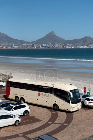 Milnerton, Cape Town, South  Africa. 10th April 2024.  Tourist coach stops off at Lagoon Beach overlooking Table Bay, Cape Town and Table Mountain.