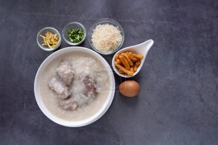 Hot Thai congee (rice porridge) with minced pork ball and boiled egg as breakfast