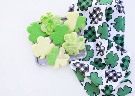 Photo for St. Patrick's Day Sugar Cookies on Tray with Shamrock Towel - Royalty Free Image
