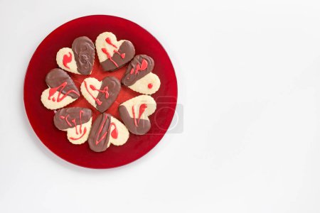 Red Glass Plate of Chocolate-dipped, Heart Cookies on White