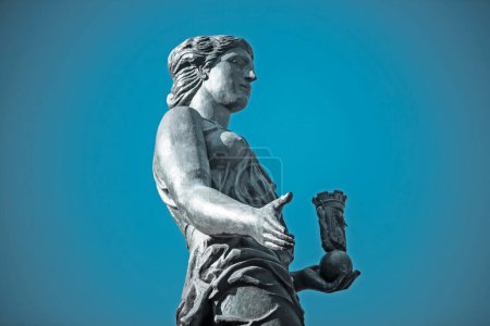 Foto de Female statue on blue sky background - Imagen libre de derechos