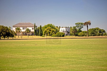Photo for Beautiful landscape of meadow and suburbia houses - Royalty Free Image