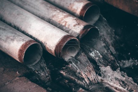 Photo for Old rusty pipe in the water - Royalty Free Image