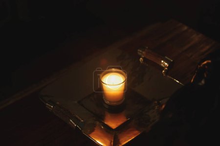 Photo for Burning candle on the table - Royalty Free Image