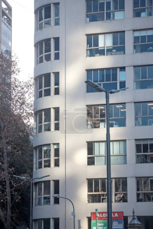 Photo for A tall building with a street light in front of it - Royalty Free Image