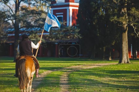 Photo for BUENOS AIRES, ARGENTINA - April 13, 2022: Man on horse with flag - Royalty Free Image