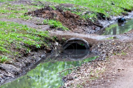 Photo for A large pipe is covered in water - Royalty Free Image