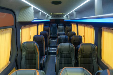 Photo for Comfortable passenger bus interior with upholstered seats - Royalty Free Image