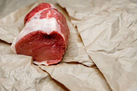 Photo for Fresh beef in pieces on a background of kraft paper - Royalty Free Image