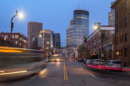 Photo for A long exposure in minneapolis looking down harmon place during twilight - Royalty Free Image