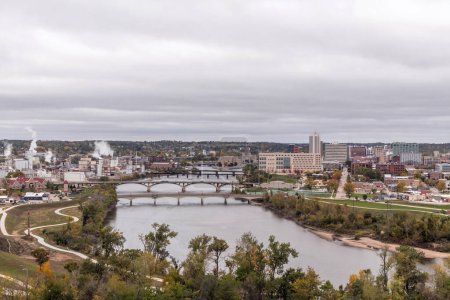Photo for A high angle cityscape of cedar rapids iowa as seen from mount trashmore on a cloudy fall day - Royalty Free Image