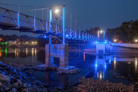Photo for A twilight wide angle long exposure of the granite falls suspension bridge illuminated blue - Royalty Free Image
