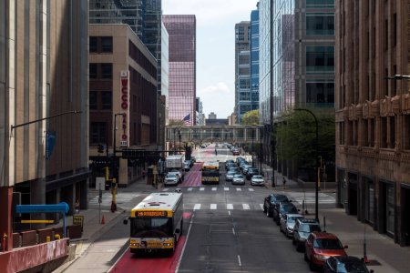 Photo for MINNEAPOLIS, MN - MARCH, 2019 - Traffic on 7th street passing through downtown Minneapolis during a spring morning. - Royalty Free Image