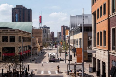 Photo for MINNEAPOLIS, MN - MAY 10, 2023: Medium shot of Wcco and downtown Minneapolis looking south over Nicollet avenue as a bus passes. - Royalty Free Image