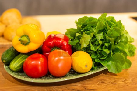 Photo for Still life of fresh organic vegetables on plate on kitchen - vegetarian and vegan - Royalty Free Image