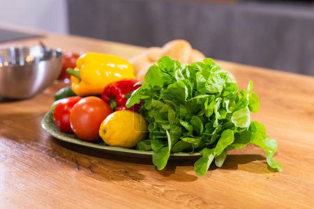 Photo for Still life of fresh organic vegetables on plate on kitchen - vegetarian and vegan - Royalty Free Image