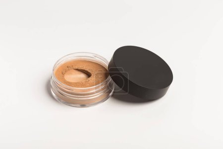 Photo for Bronzer or brown eye shadow mineral face powder. Facial powder isolated on white - Royalty Free Image