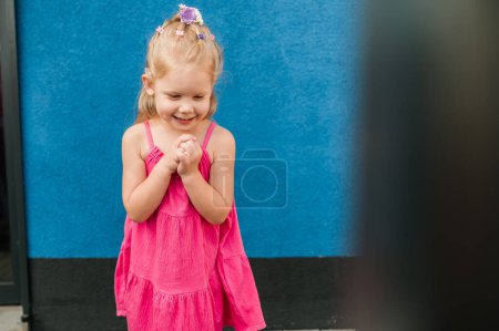 Photo for Child girl with hearing aids and cochlear implants having fun outdoor speak and playing. Copy space and empty place for advertising. - Royalty Free Image