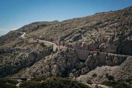 Formentor, Mallorca 10 September 2023; Tourist bus on the mountain road of the Cape Formentor. Island Majorca, Spain.