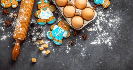 Photo for Christmas gingerbread on dark background top view. Xmas holiday celebration and cooking concept - Royalty Free Image