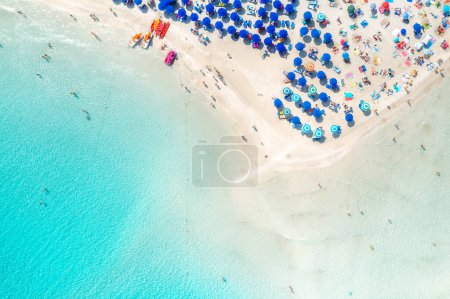 Photo for Top view of beautiful sandy beach with turquoise sea water and colorful umbrellas, Islands of Sardinia in Italy, aerial drone shot - Royalty Free Image
