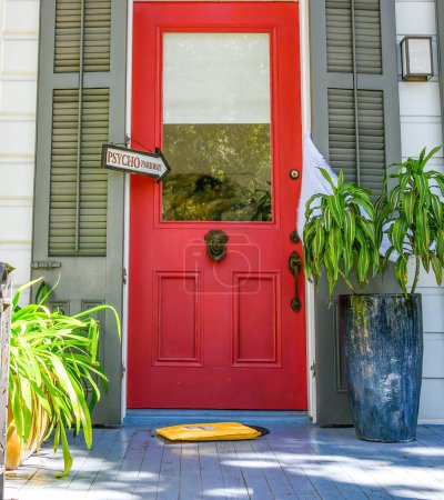 Photo for NEW ORLEANS, LA, USA - NOVEMBER 4, 2023: Front door of home displaying "Psycho Parkway" sign as leftover Halloween decoration - Royalty Free Image