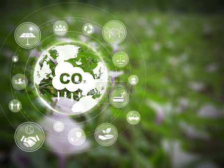 Photo for Reduce CO2 emission concept with refreshing green field in the background. Many icons on helping reduce the carbon dioxide in the air. - Royalty Free Image