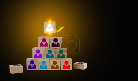 Foto de Wooden blocks with people icons, putting the right man into the right position, HR concept, recruitment, human resources and management - Imagen libre de derechos