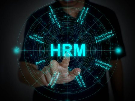Foto de A finger tapping or activating HRM function on a futuristic virtual screen with eight components of HRM. Human Resource Management concept. - Imagen libre de derechos