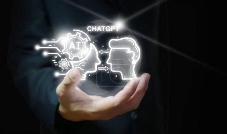 Ein Geschäftsmann hält eine virtuelle Grafik von Chatgpt in der Hand. Chatbot, Chat mit KI, Künstliche Intelligenz, futuristische technologische Transformation. Ai-Technologie.