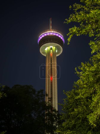 Photo for This spectacular photograph showcases the Tower of the Americas in San Antonio, Texas, at its most vibrant and captivating. Illuminated against the night sky, the tower's colorful lights dance and shimmer, creating a breathtaking display of modern ar - Royalty Free Image