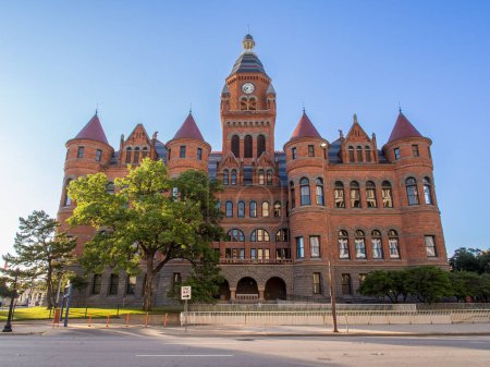 This stunning photograph captures the grandeur and elegance of the Dallas County Courthouse with a clear blue sky as the perfect backdrop. The neoclassical architecture and intricate detailing of the courthouse are breathtaking, serving as a symbol o