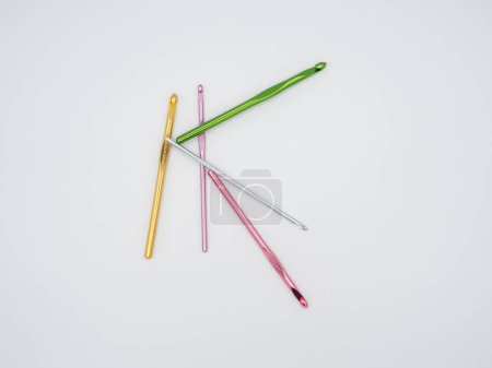 Photo for A collection of crochet hooks in different colors is isolated against a white backdrop. - Royalty Free Image