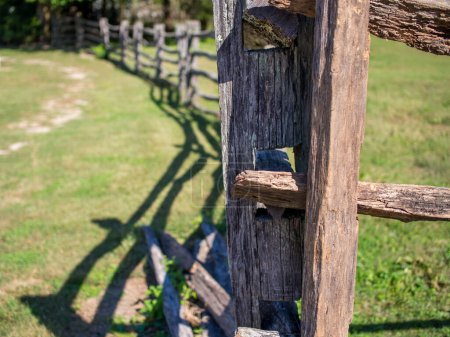 Photo for Intricate features of a vintage, traditional weathered wooden fence in Williamsburg, Virginia. - Royalty Free Image