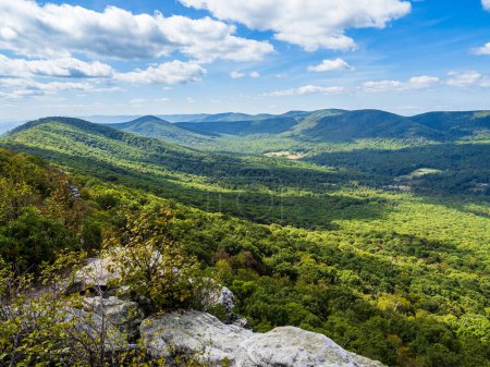 Photo for The beautiful wilderness with wooded mountains with rocks in the foreground as seen from Big Schloss via Wolf Gap Trail on the border between West Virginia and Virginia. - Royalty Free Image