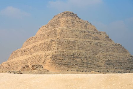 Panoramic view of Stepped Pyramid of Djoser at Saqqara Egypt on a foggy morning under clouds