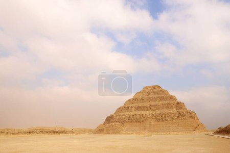 Photo for Panoramic view of Stepped Pyramid of Djoser at Saqqara Egypt on a foggy morning under clouds - Royalty Free Image