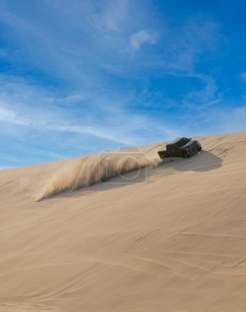 Photo for Desert Safari, a black SUV is bashing through the arabian sand dunes in Doha, Qatar - Royalty Free Image
