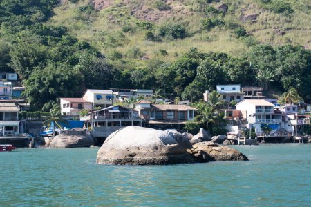 houses on the hill slops at the coast of atlantic isles, rio, brazil