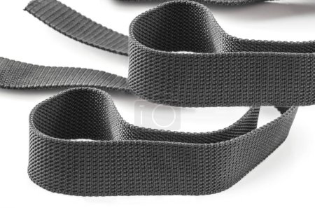 Photo for Two strands of gray coarse textured nylon fabric belt isolated on white background - Royalty Free Image