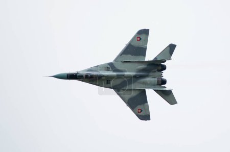Téléchargez les photos : SLIAC, SLOVAKIA - AUGUST 30: flight of MiG-29AS during SIAF airshow in Sliac, Slovakia on August 30, 2014 - en image libre de droit