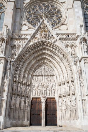 Photo for Statues, decorations and reliefs above the door to the Votive Church (Votivkirche) in Vienna, Austria - Royalty Free Image
