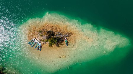 Photo for Idyllic View of People Relaxing on SUP Boards after Paddling to a Secluded Island Enjoy the Serenity and Solitude of the Sea - Royalty Free Image