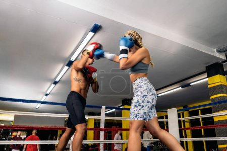 Photo for Unrecognizable young adult man and woman training box on the ring. Concept of box and training. - Royalty Free Image